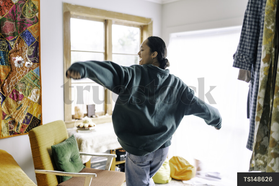 Teen Girl Dancing in Bedroom