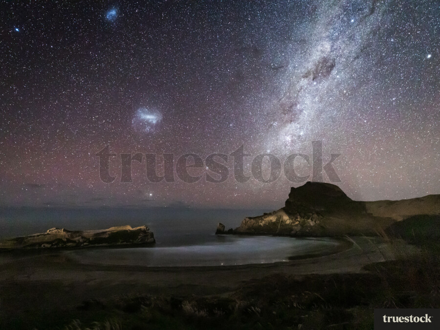 Milky Way rising above the ocean bay
