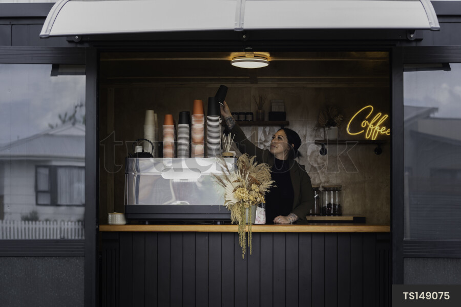 Barista Grabbing Cup