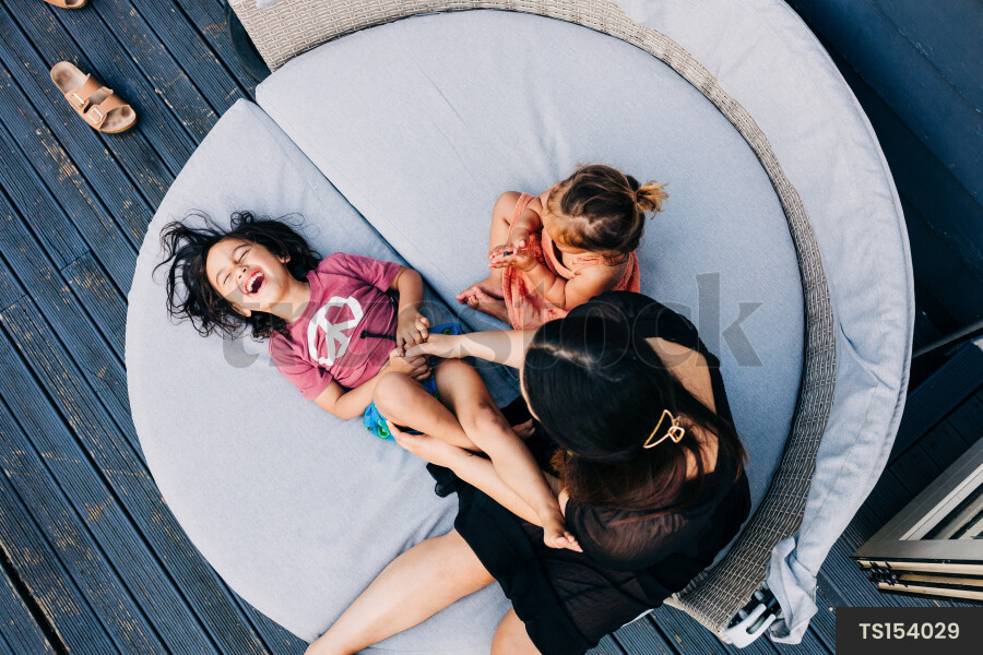 Top down view of Māori family on deck