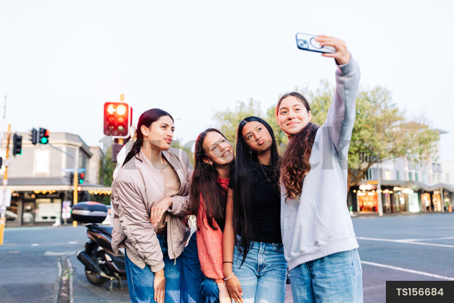 Friends in city at sunset