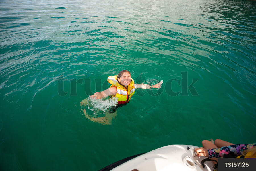 Teen Girl Jumping off Boat