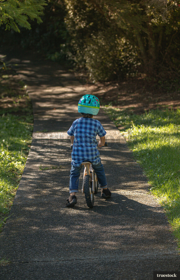 Child going for a bike ride on a pushbike