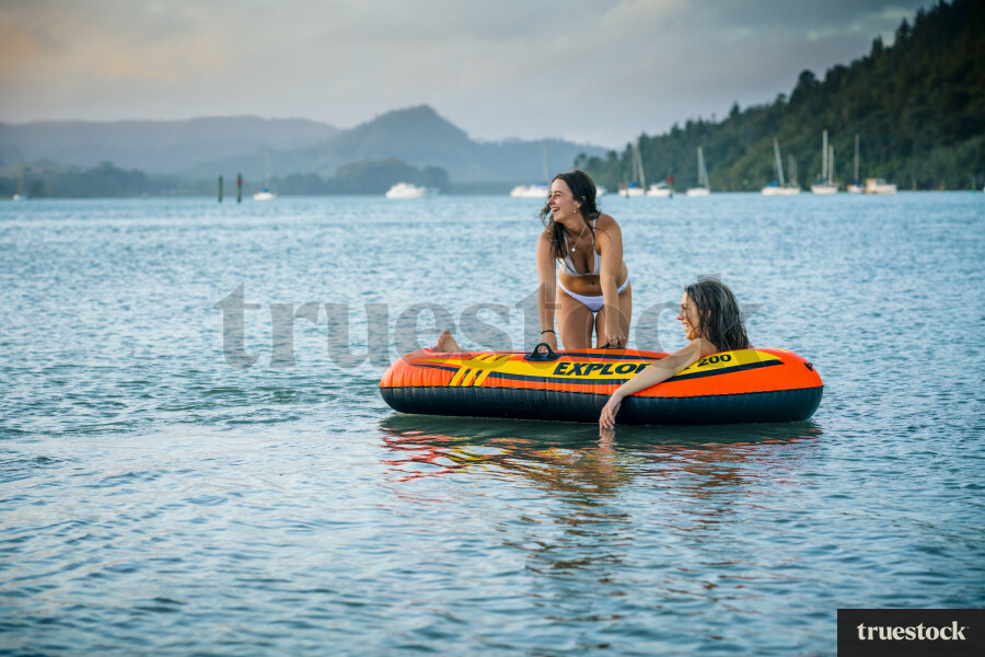 Woman Relaxing in an Inflatable Boat
