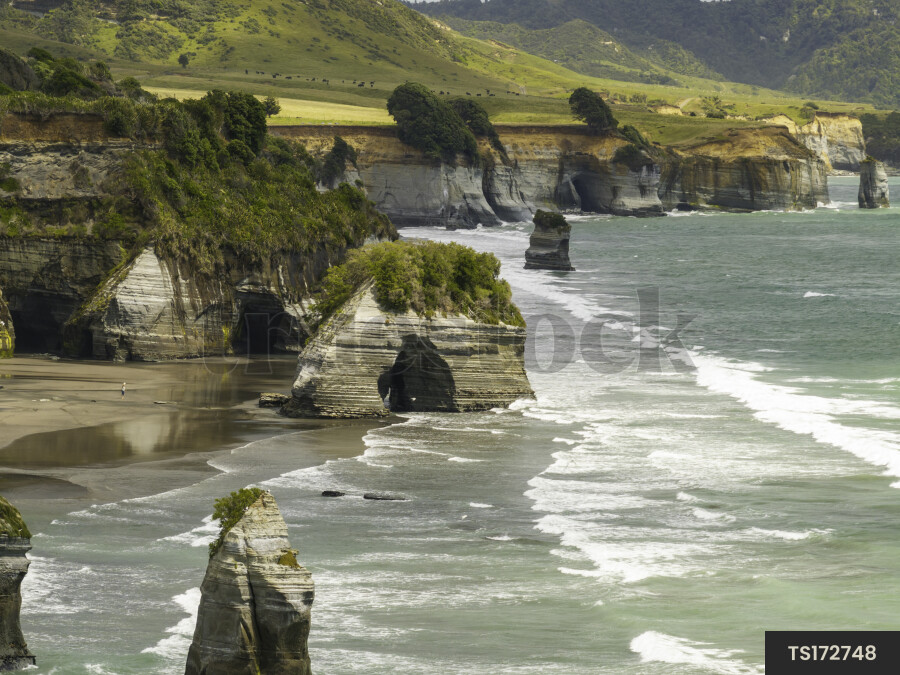 Aerial view of beach with rock formations in Tongaporutu