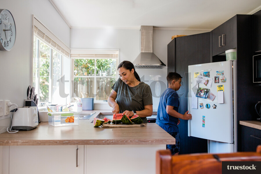 Mother and son preparing food