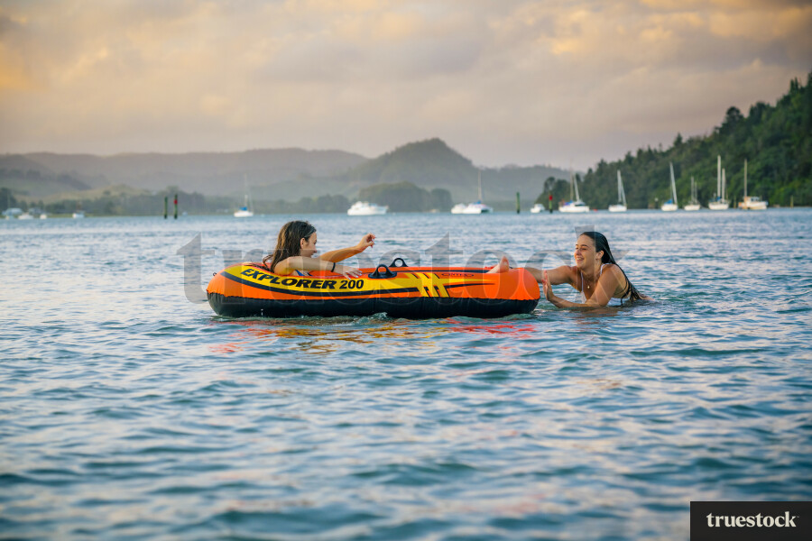 Woman Relaxing in an Inflatable Boat