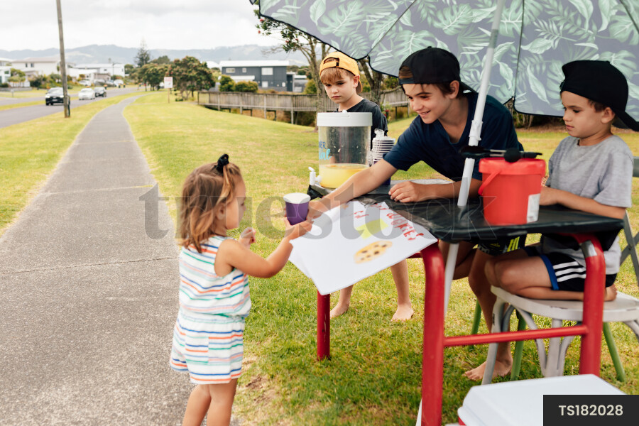 Kids Buying Lemonade at Lemonade Stand