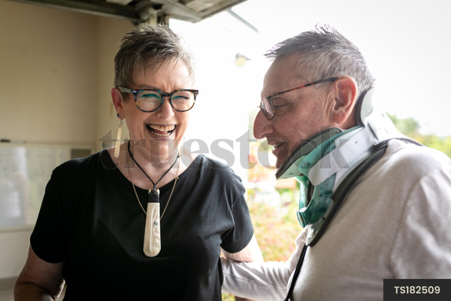 Health carer with patient in garage
