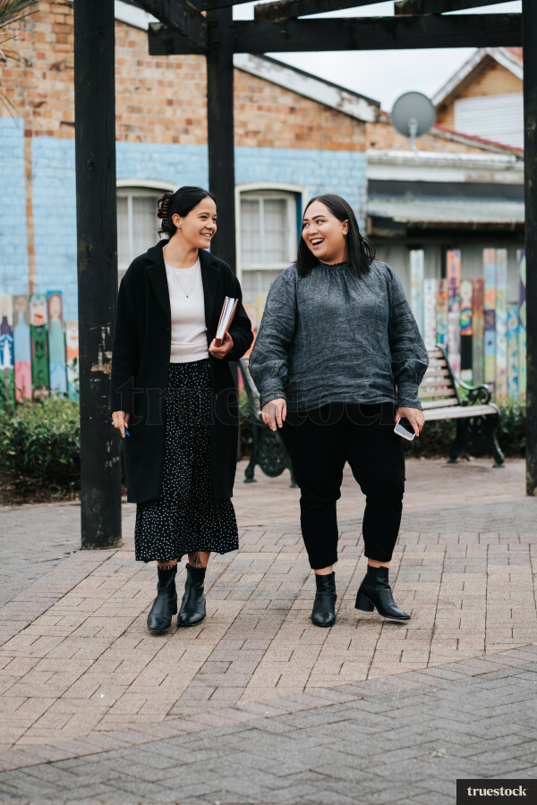 Colleagues Talking While Walking