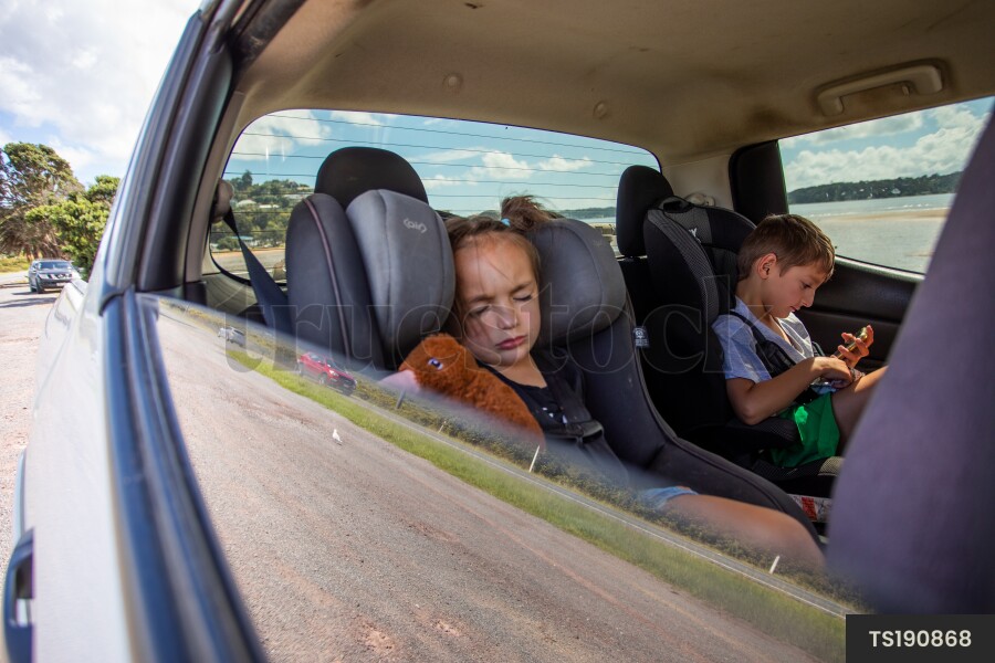 Brother and Sister in Back of Car