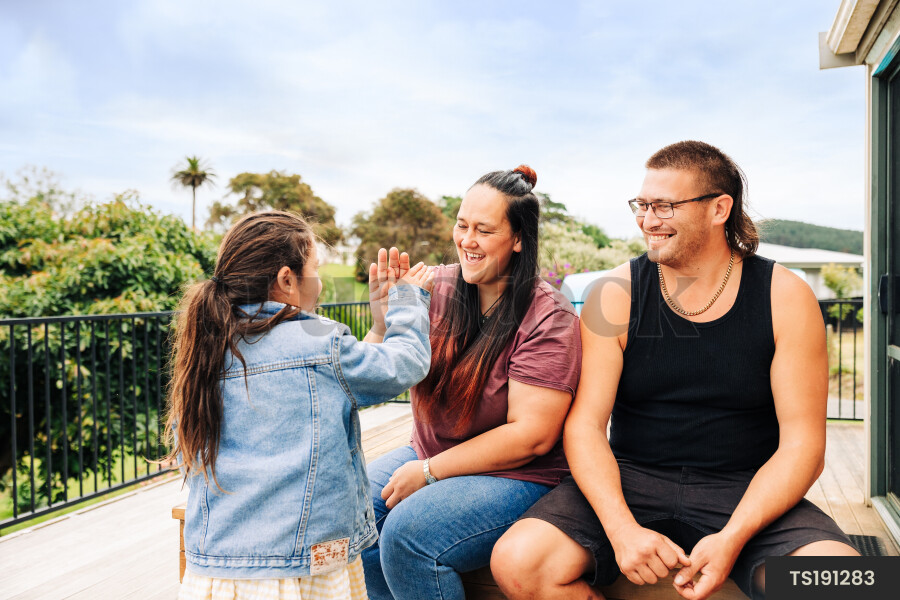 Girl with her parents on deck