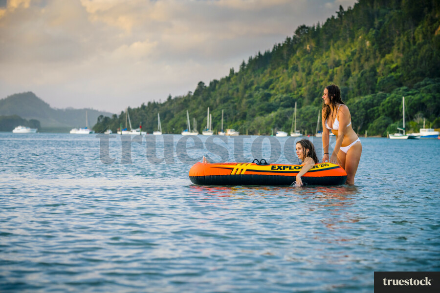 Woman Relaxing in an Inflatable Boat