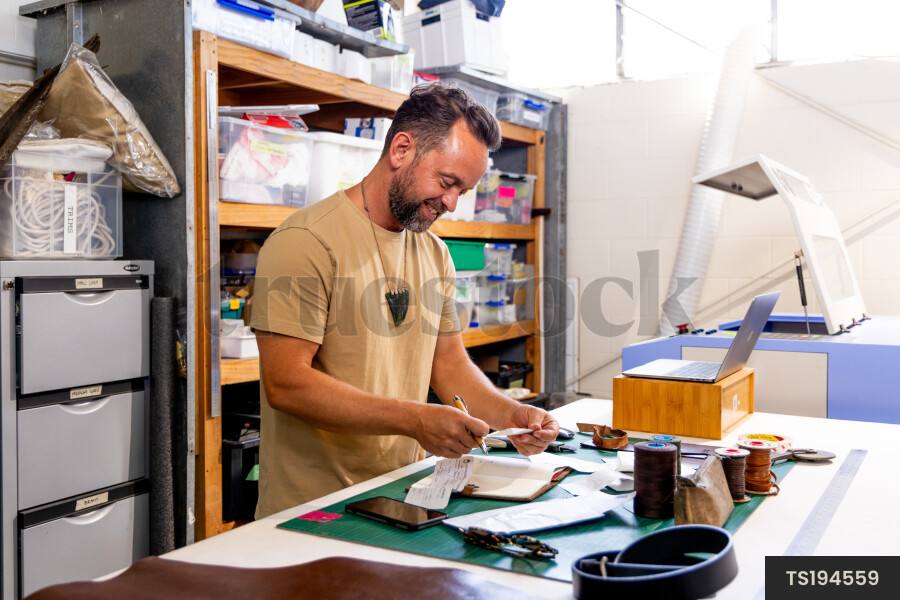 Leather craftsman in workshop