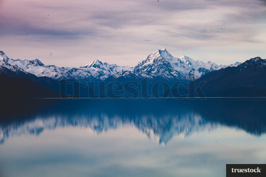 Snow on Mount Cook Aoraki mountain ranges by a lake