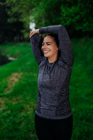 Woman in activewear stretching