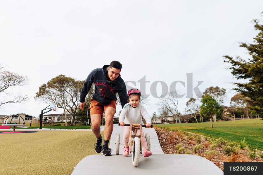 Young Girl on Bike at Park