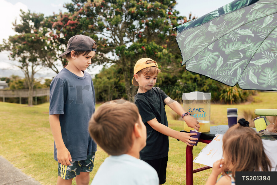 Kids Buying Lemonade at Lemonade Stand