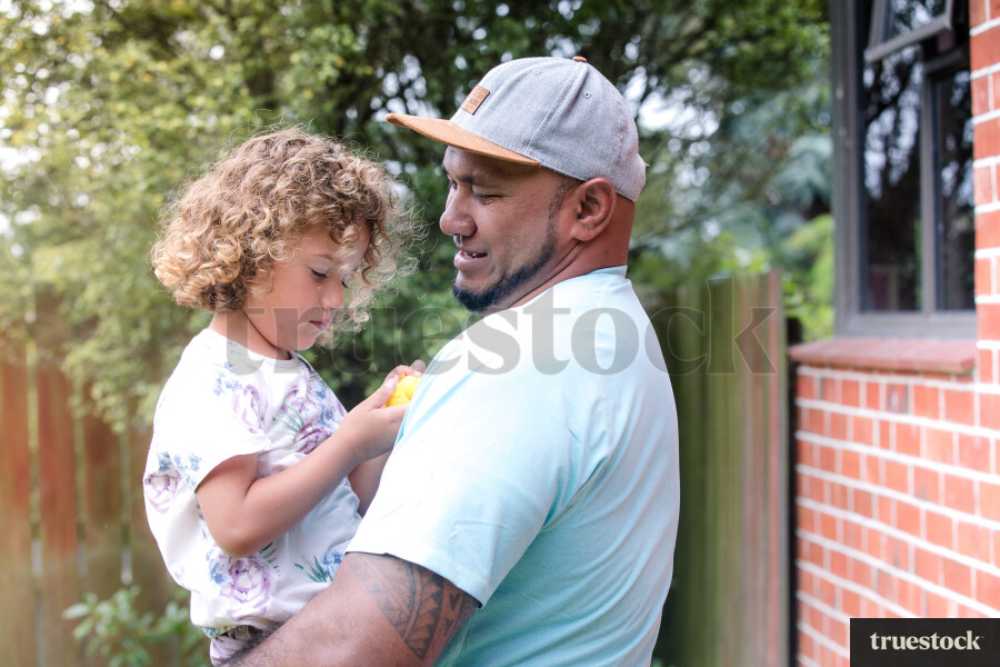 Father Holding Daughter
