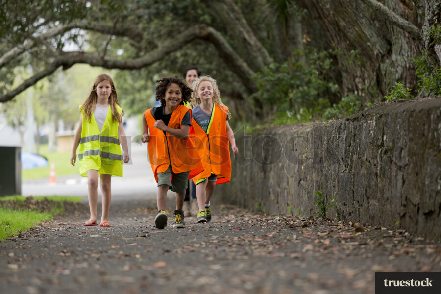 Kids walking along footpath