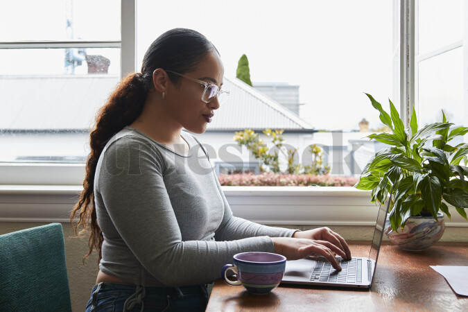 Woman Using Laptop While Working