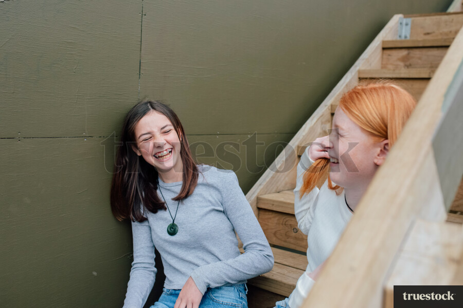 Teen Girls Sitting on Stairs