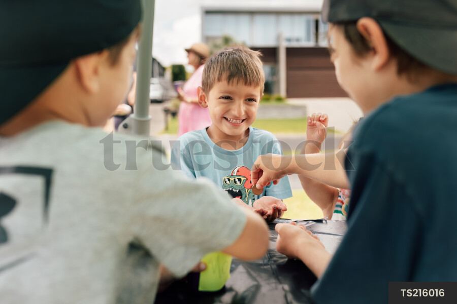 Kids Buying Lemonade at Lemonade Stand