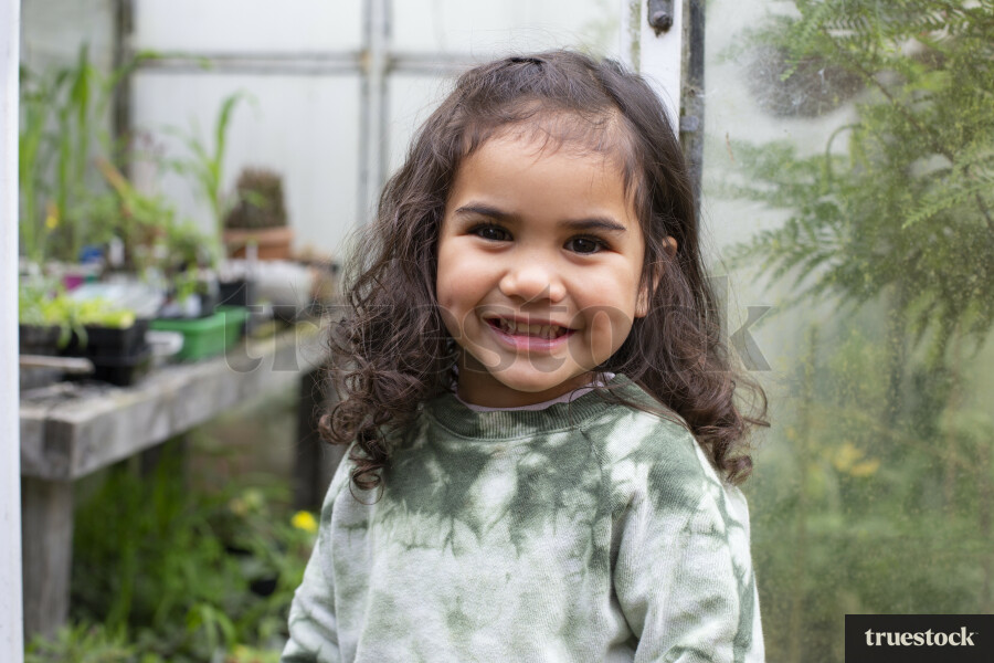 Young Girl in Greenhouse