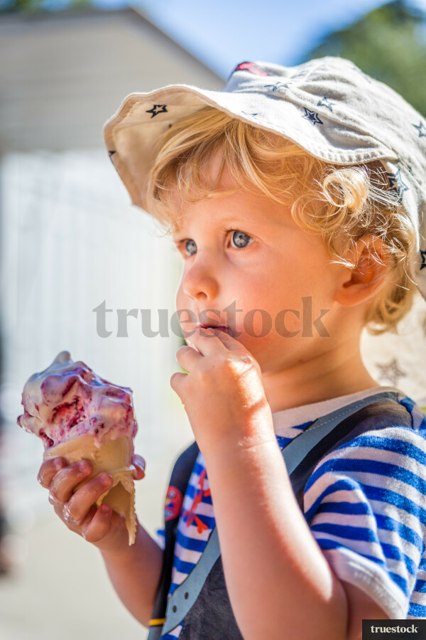 Toddler eating an ice cream