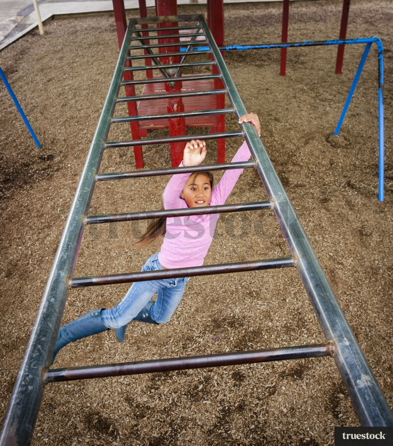 Young Girl Playing on Playground