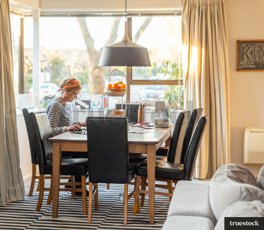 Adult working from home at the dining table