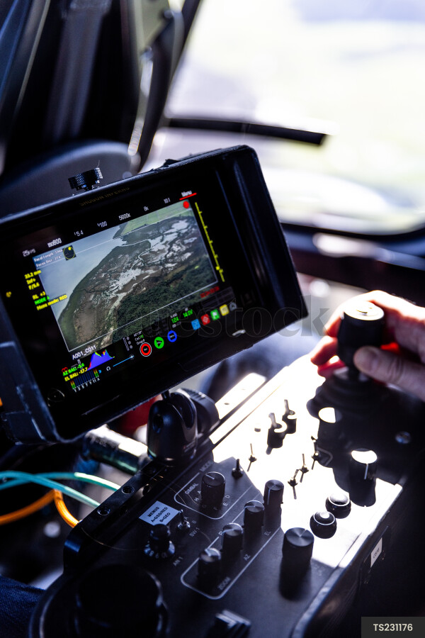 Monitor in helicopter flying over Kaipara Harbour