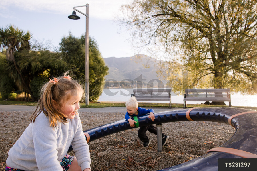 Family playing on playground equipment