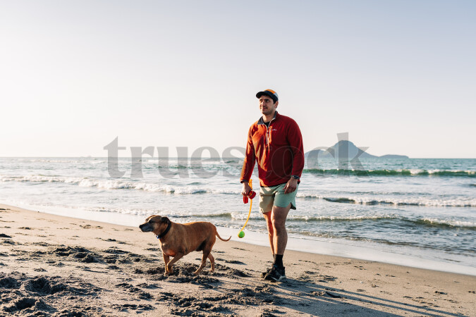 Man with dog on beach