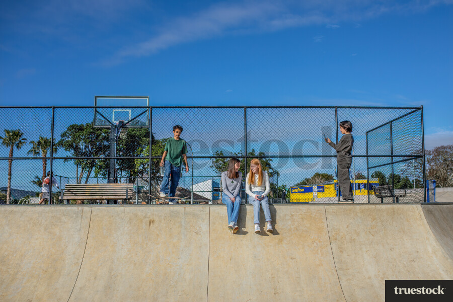 Teenagers In Skatepark Recording Skateboarding
