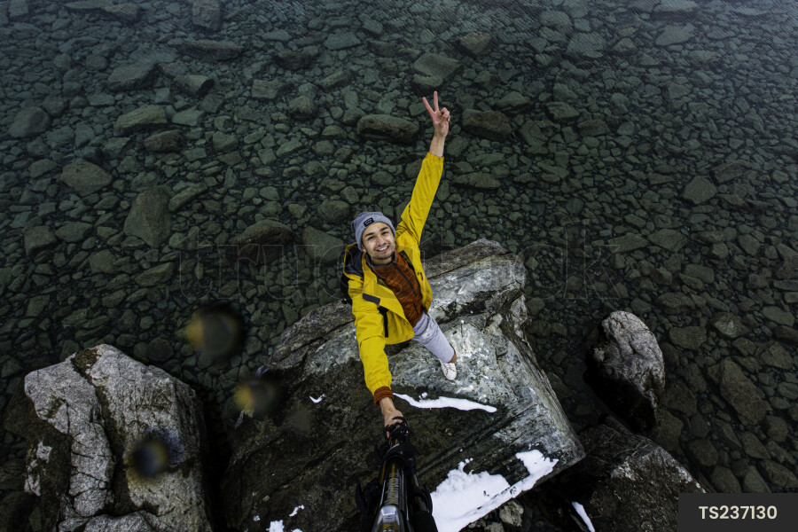 Tourist Taking Selfie by Lake