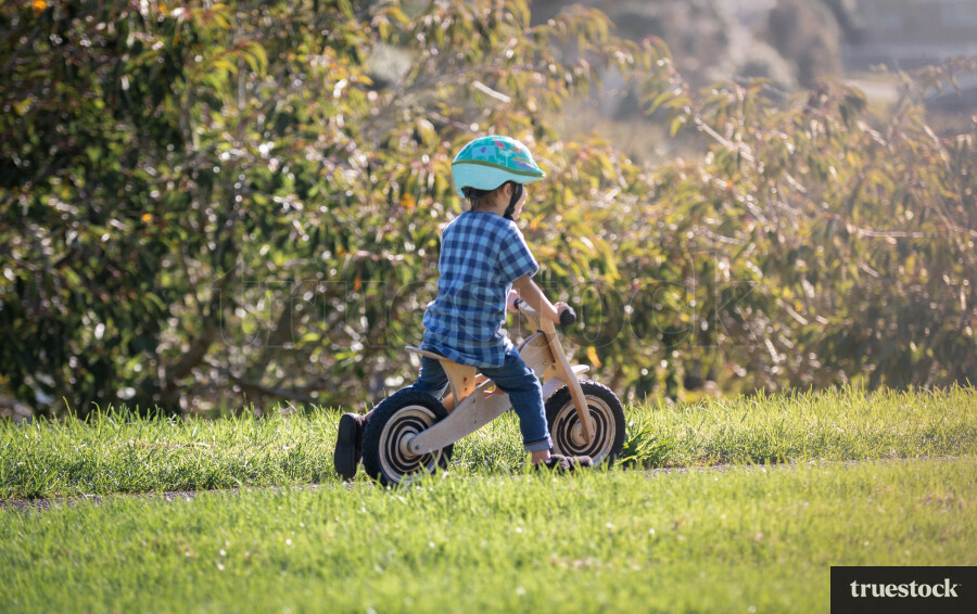 Child going for a bike ride on a pushbike