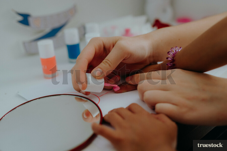 Child getting nails painted