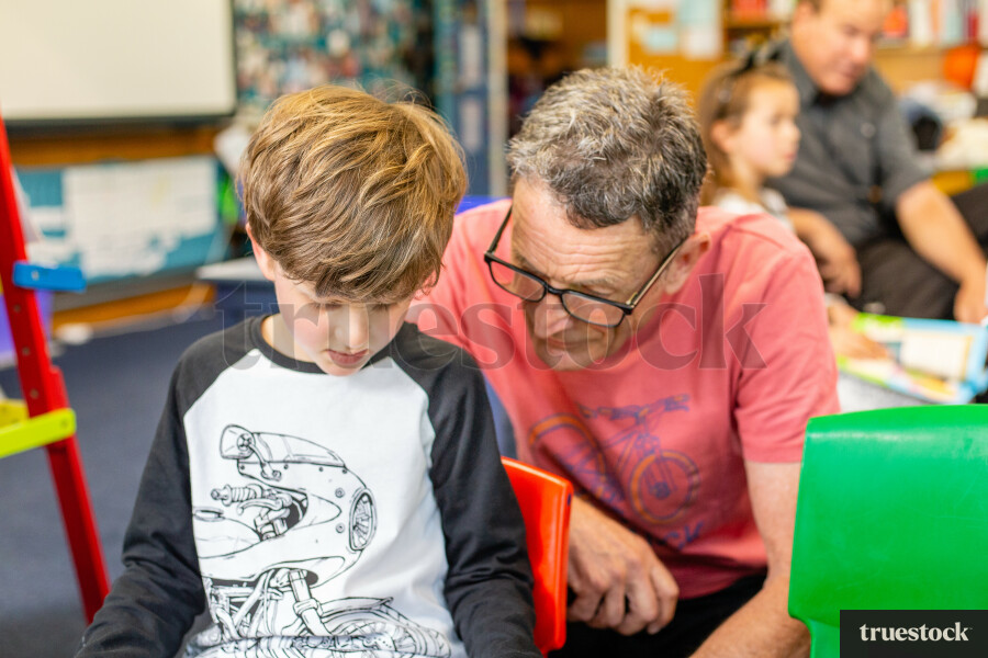 Teacher and pupil at school