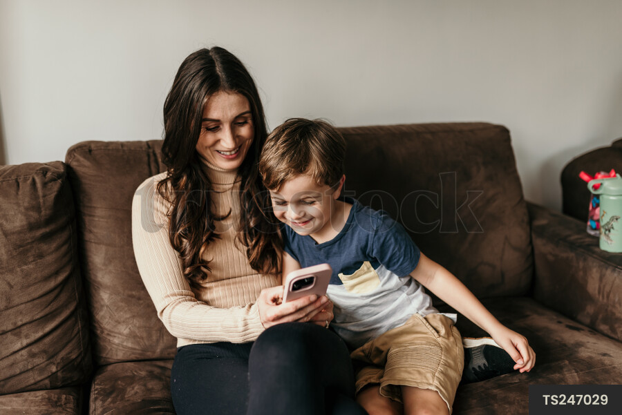 Mother and Son Using Phone