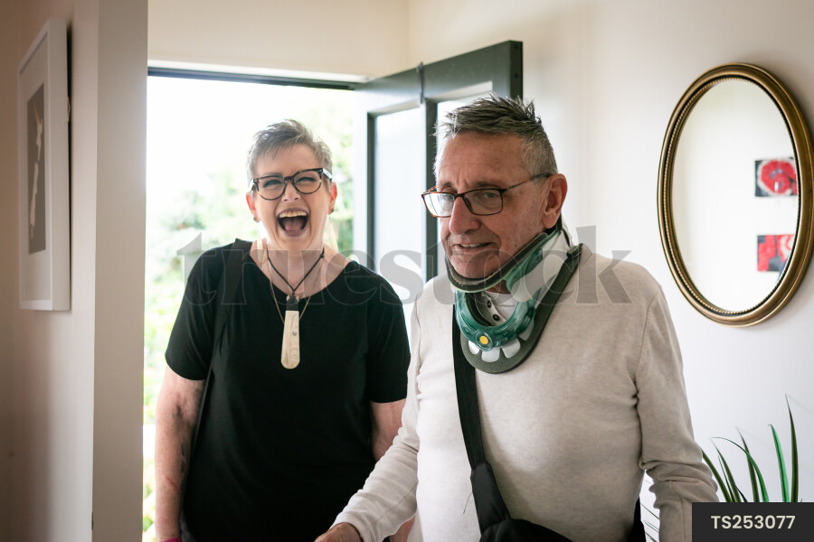 Health carer and patient at front door