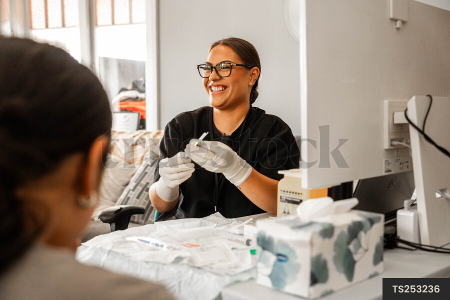 Nurse giving patient vaccine