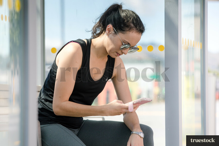 Female waiting at a bus stop