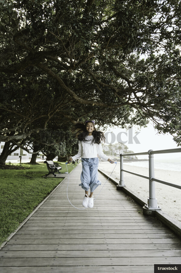 Young Girl Playing with Jumping Rope