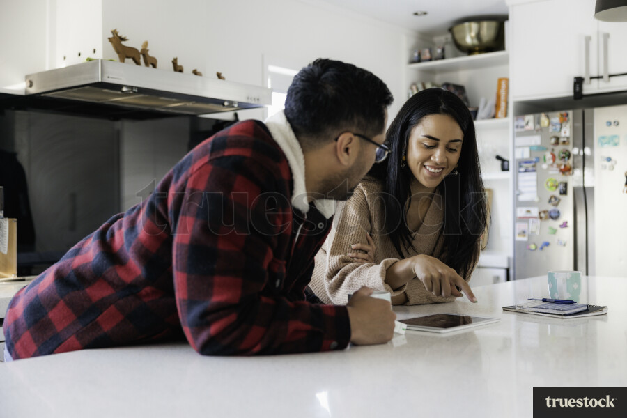 Parents Chat in Kitchen