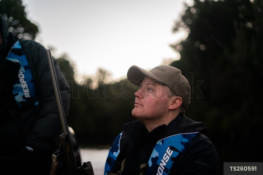 Man in life jacket at sunset