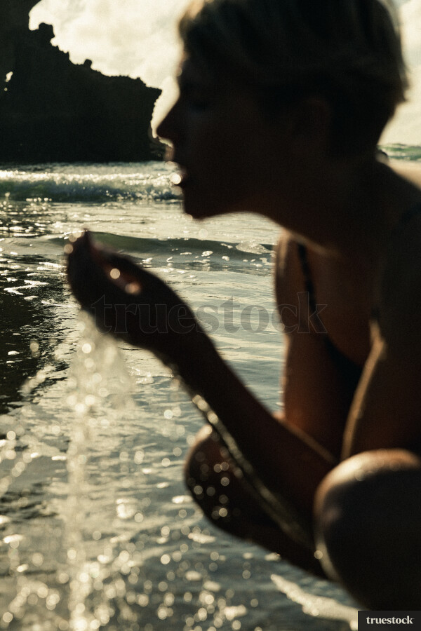 Woman Swimming at Piha Beach