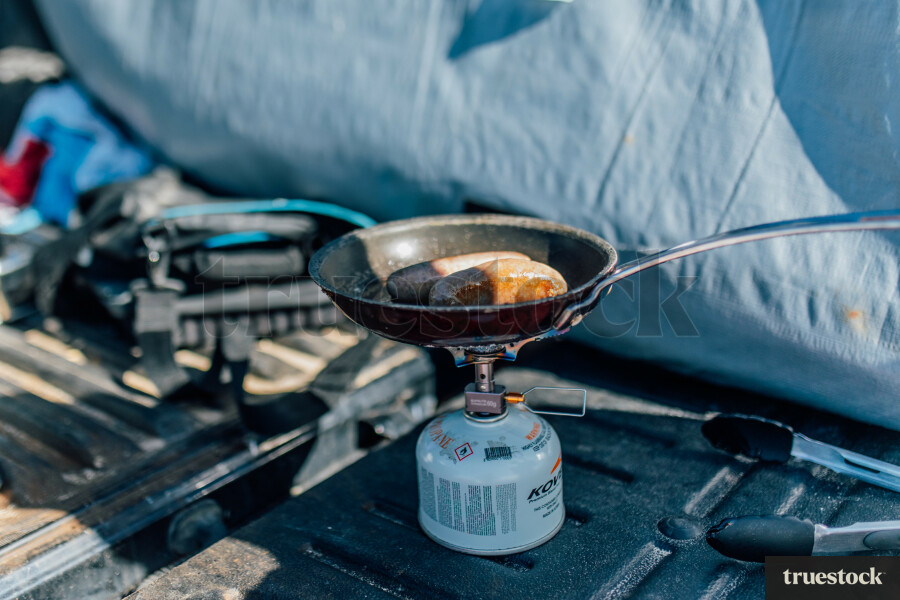 Sausages Being Cooked at the Beach