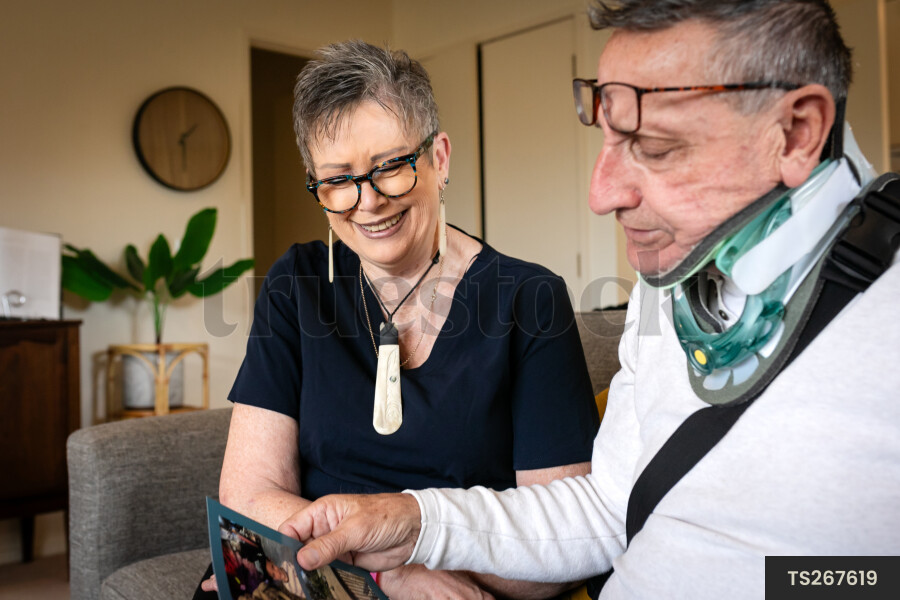 Health carer and patient with photo album