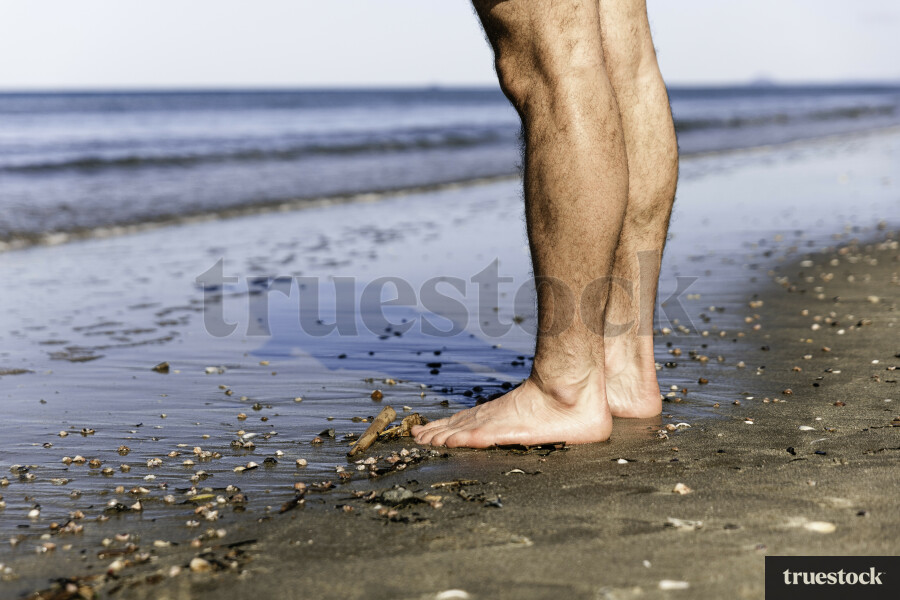 Close Up of Feet on Beach